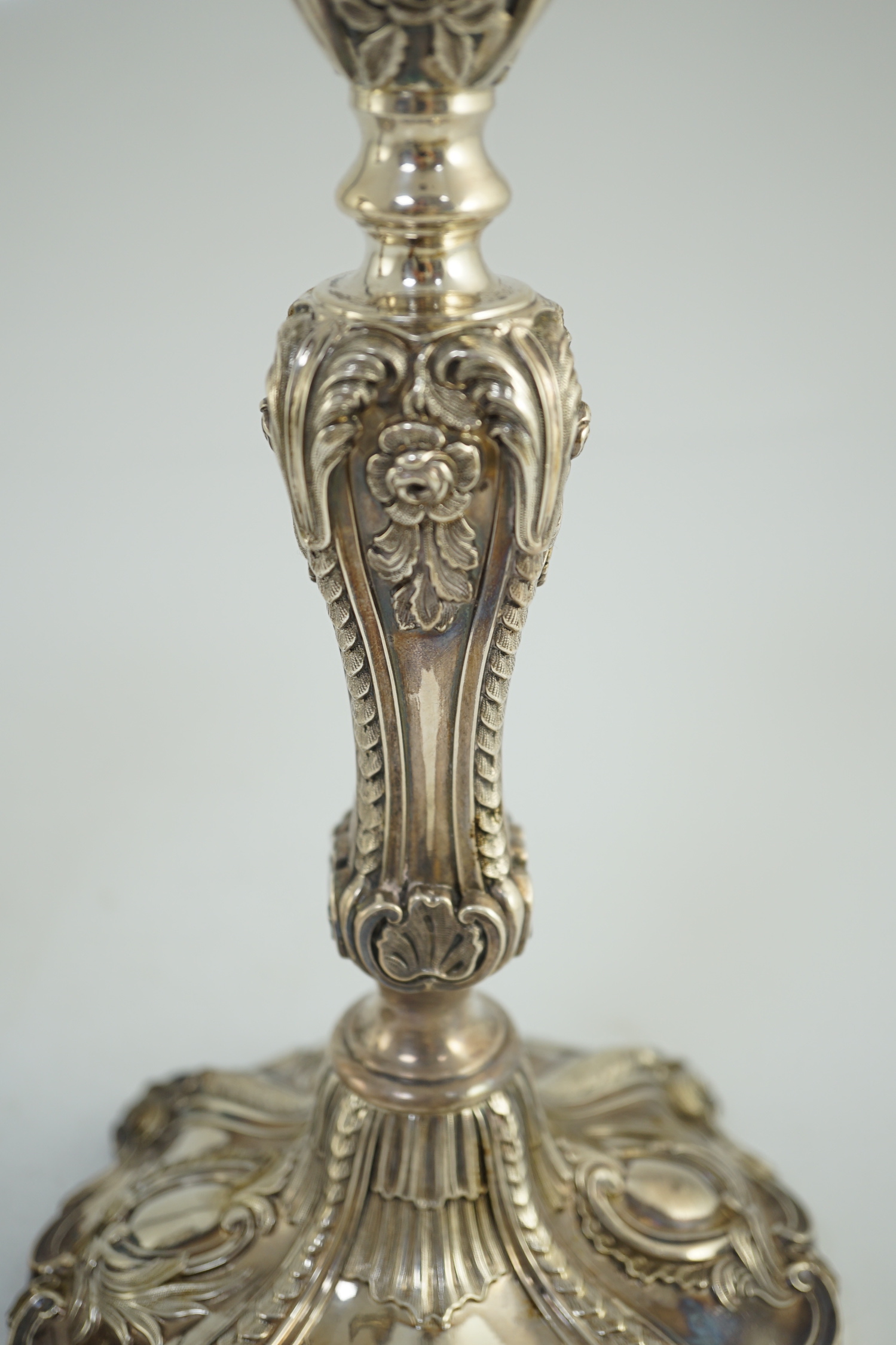 An ornate pair of early Victorian silver candlesticks by Creswick & Co